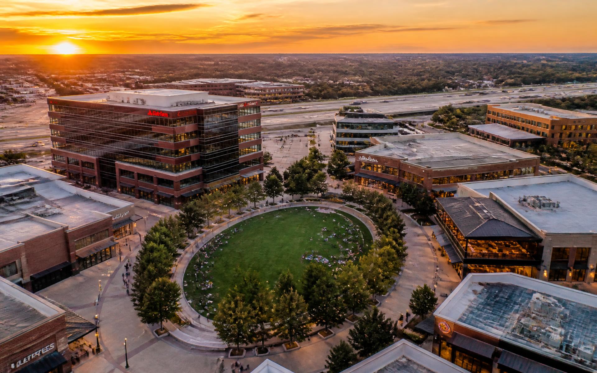 Aerial rendering of the Lake District West mixed-use development at sunset
